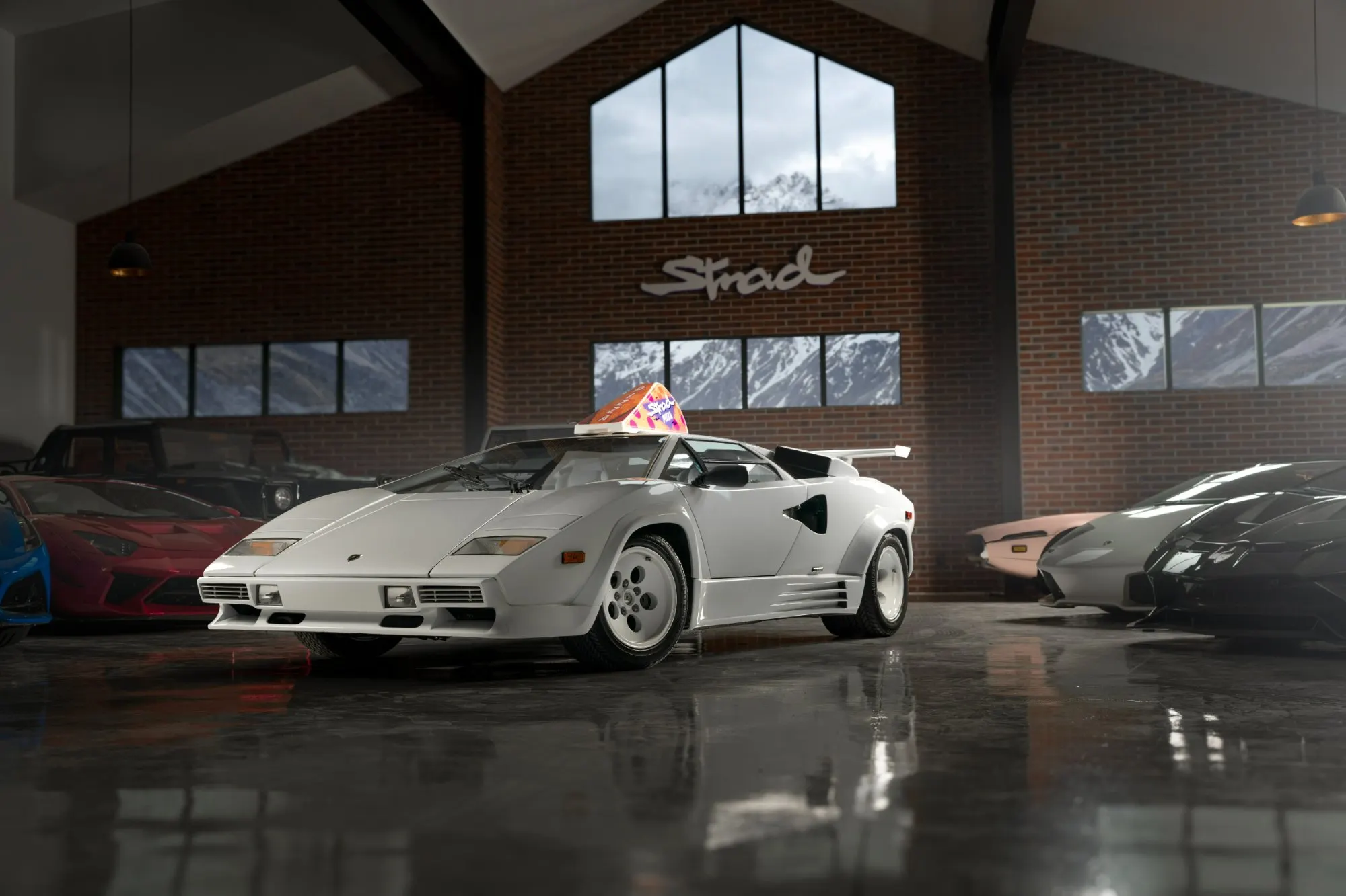 White wedge supercar on a showroom floor under the neon sign