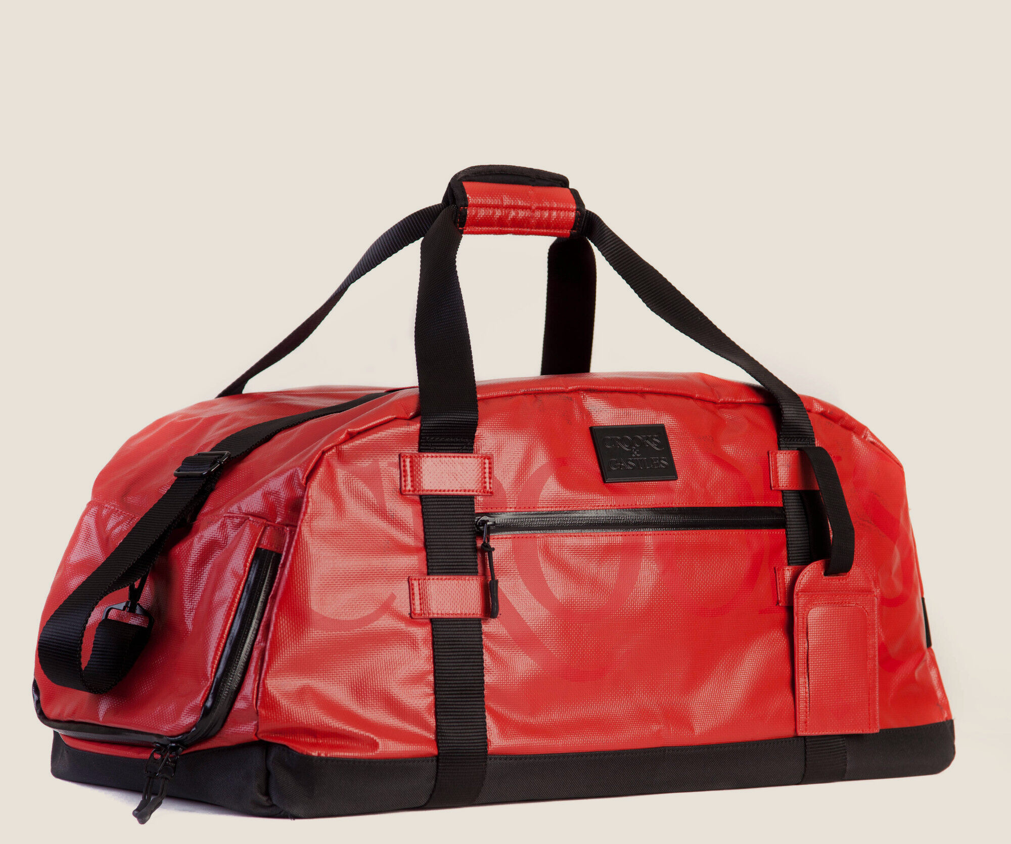 Red coated canvas duffle with webbing straps